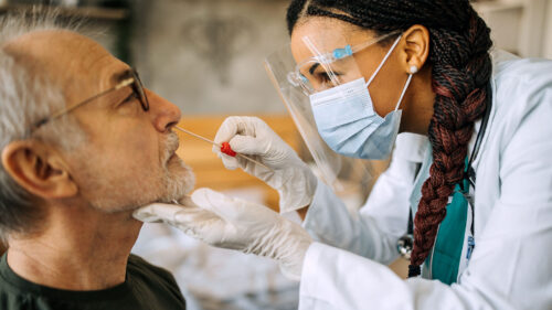 Male patient getting tested for COVID